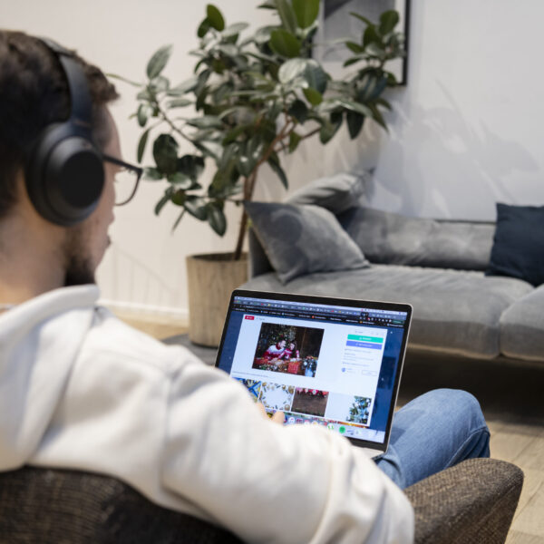 man-working-from-home-while-sitting-armchair